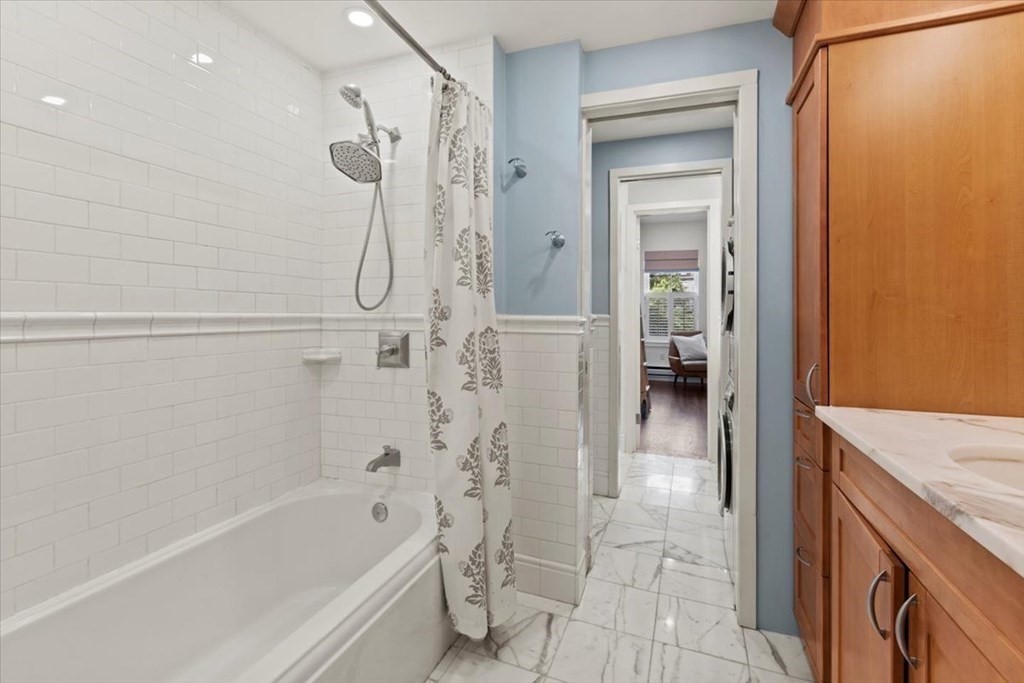 54 Appleton Street, Unit 4 Boston, MA 02116 - Photo 13 of 20 a bathroom with a tub a sink and a shower