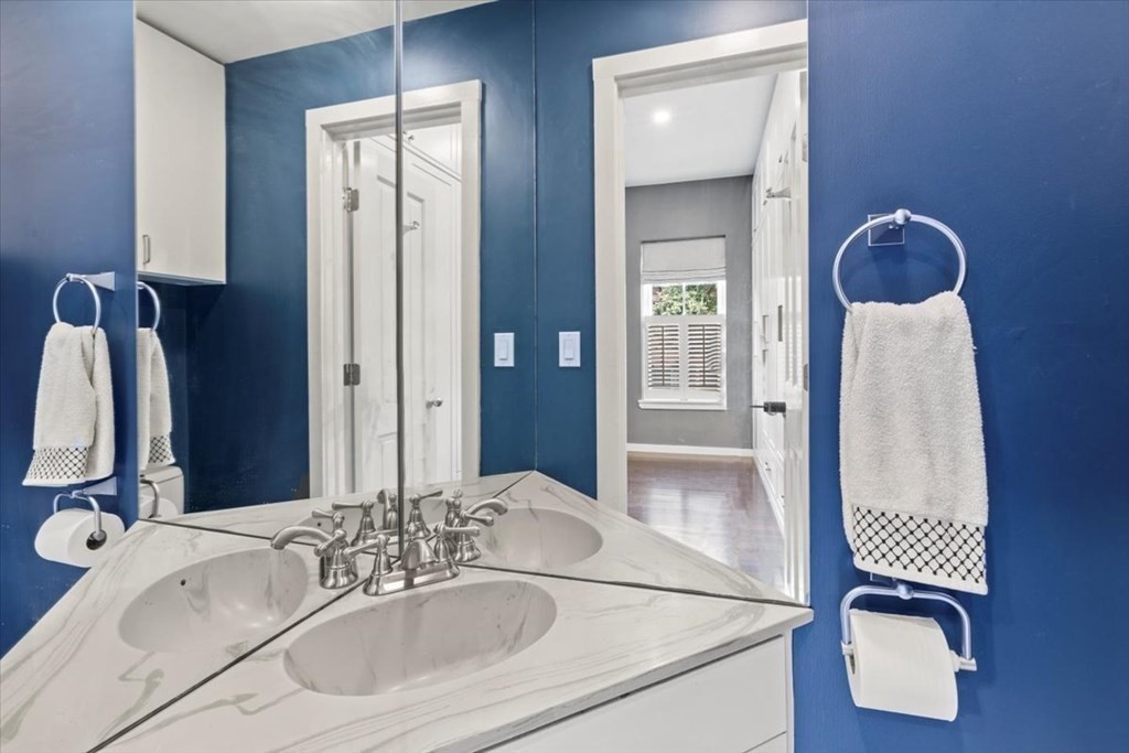 54 Appleton Street, Unit 4 Boston, MA 02116 - Photo 19 of 20 a bathroom with a tub sink and mirror