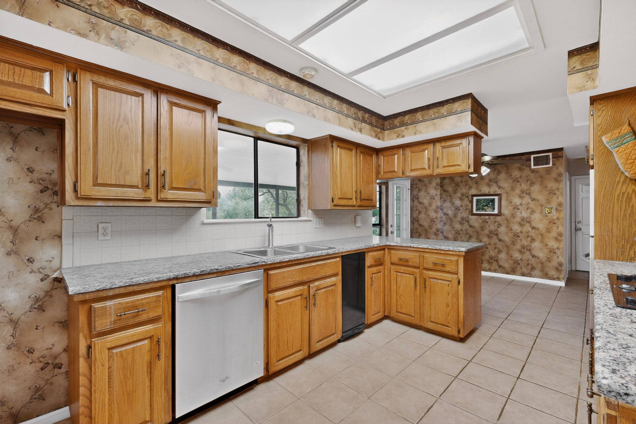 1003 Pier Branch Road Dripping Springs, TX 78620 - Photo 21 of 40 A well-equipped kitchen awaits, featuring a double basin sink and ample cabinetry.