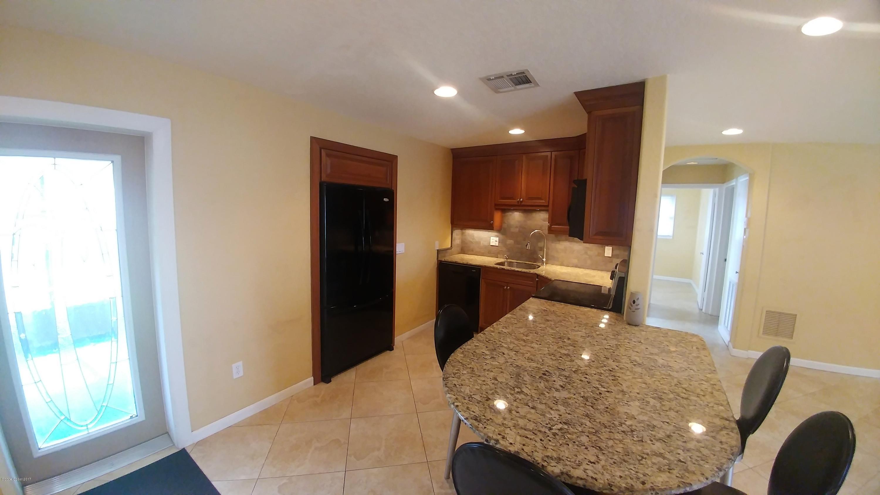 2857 Tropic Road Melbourne, FL 32935 - Photo 14 of 28 a living room with furniture and a large window
