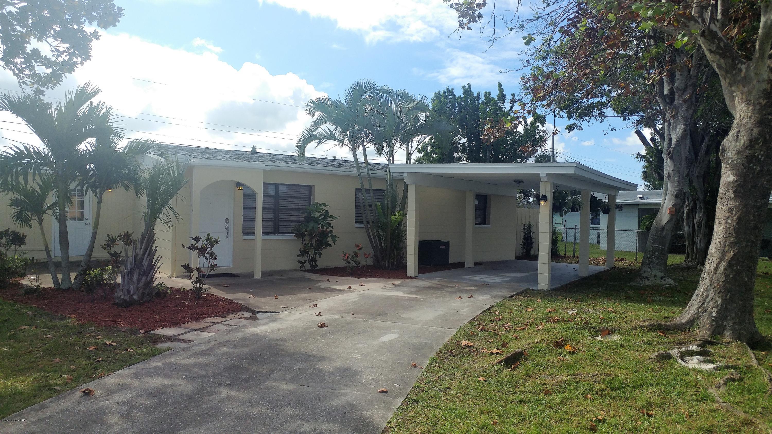2857 Tropic Road Melbourne, FL 32935 - Photo 3 of 28 a view of a house with a yard