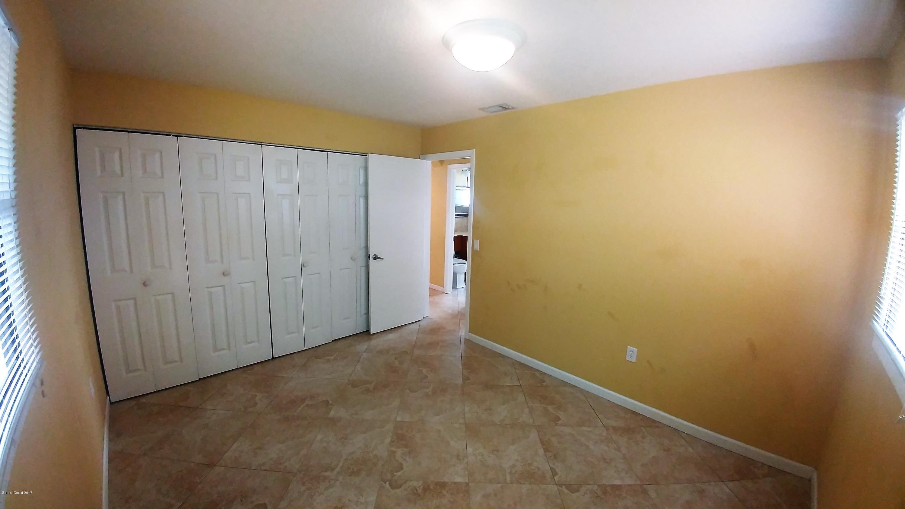 2857 Tropic Road Melbourne, FL 32935 - Photo 26 of 28 an empty room with yellow walls