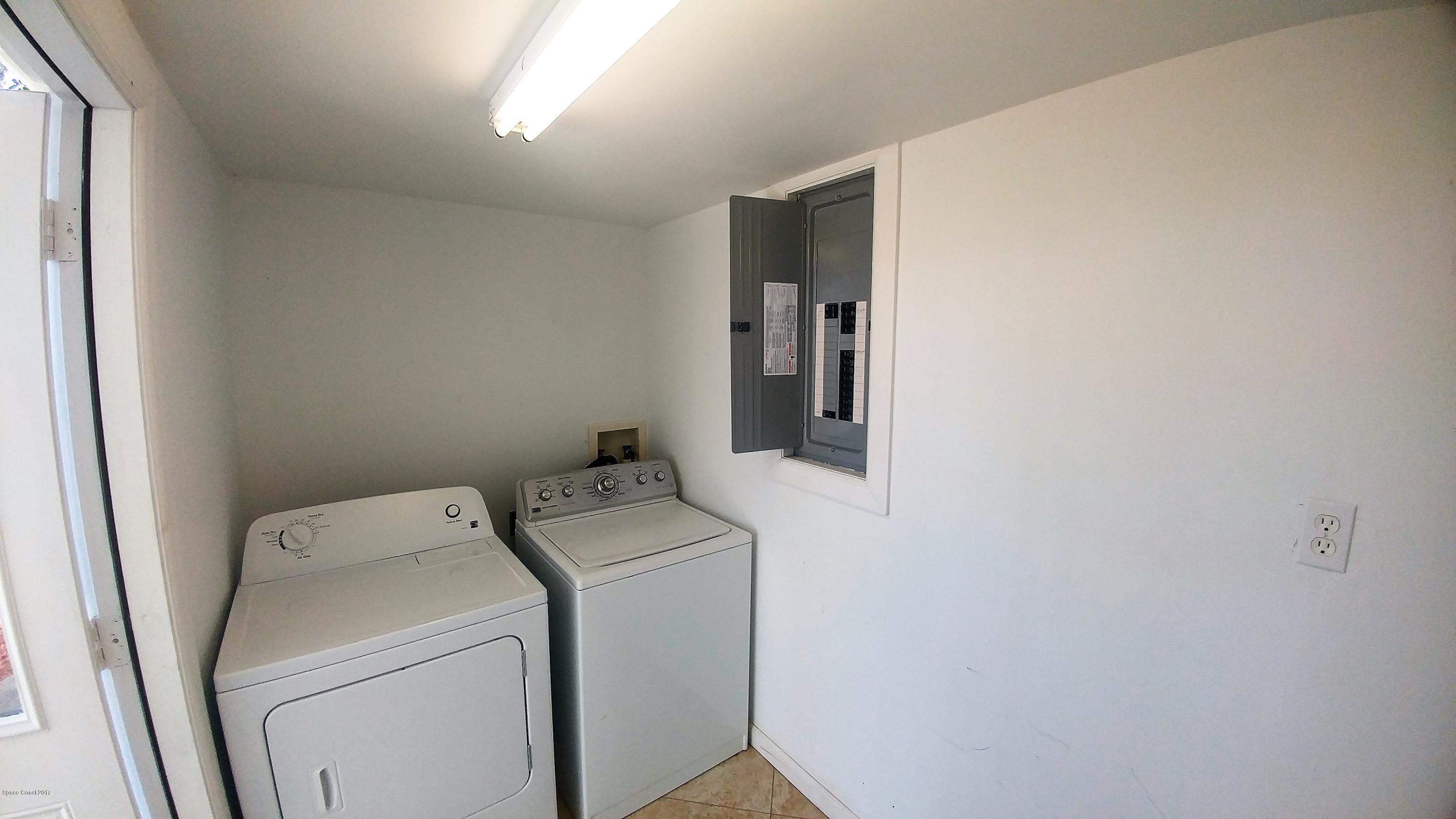 2857 Tropic Road Melbourne, FL 32935 - Photo 27 of 28 a utility room with dryer and washer
