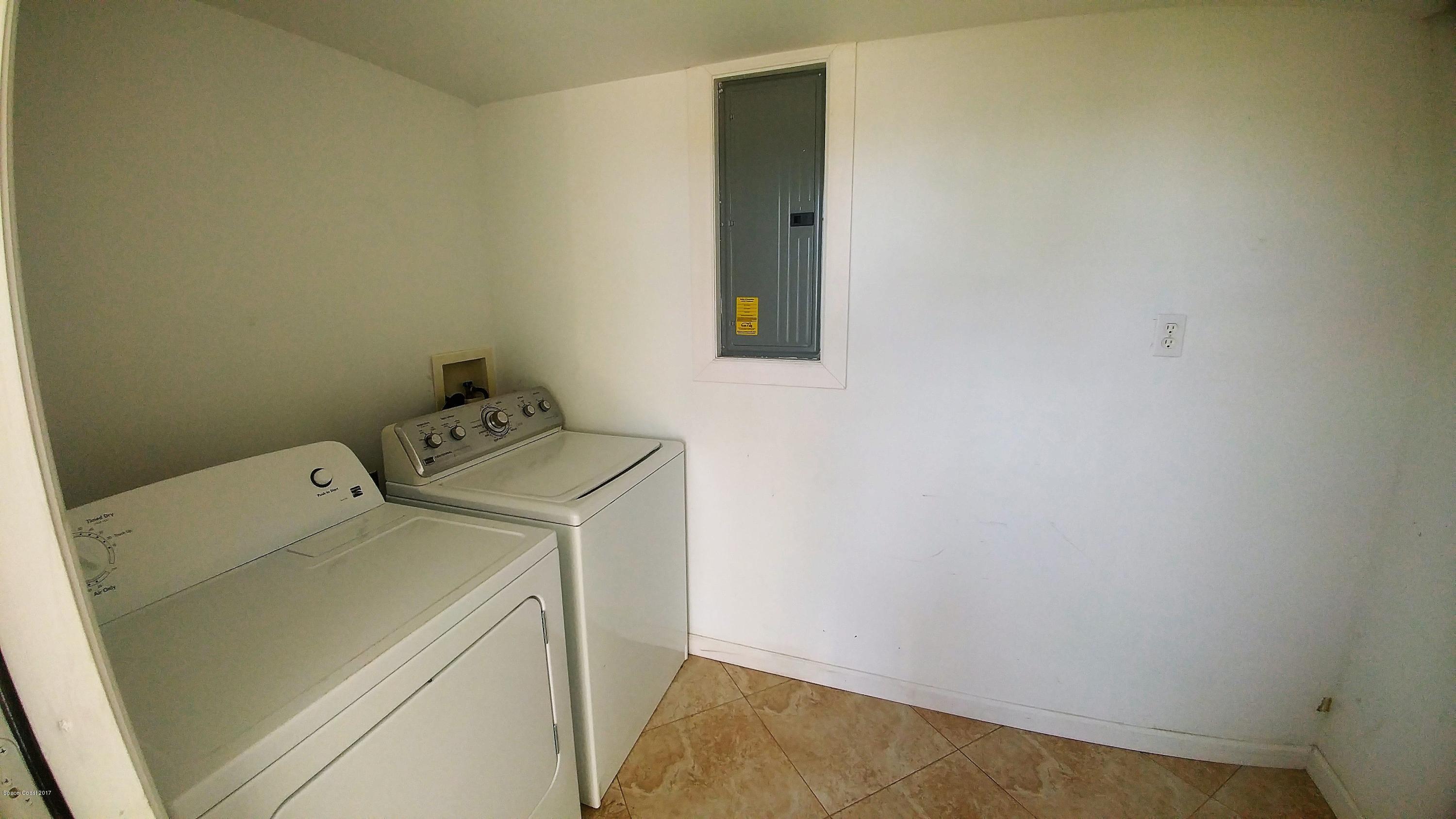2857 Tropic Road Melbourne, FL 32935 - Photo 28 of 28 a utility room with dryer and washer