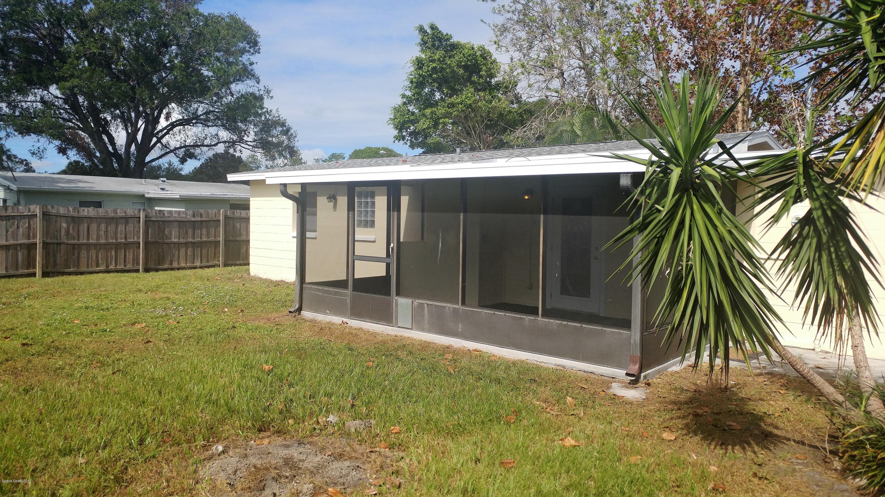 2857 Tropic Road Melbourne, FL 32935 - Photo 10 of 28 a view of a backyard with a large tree