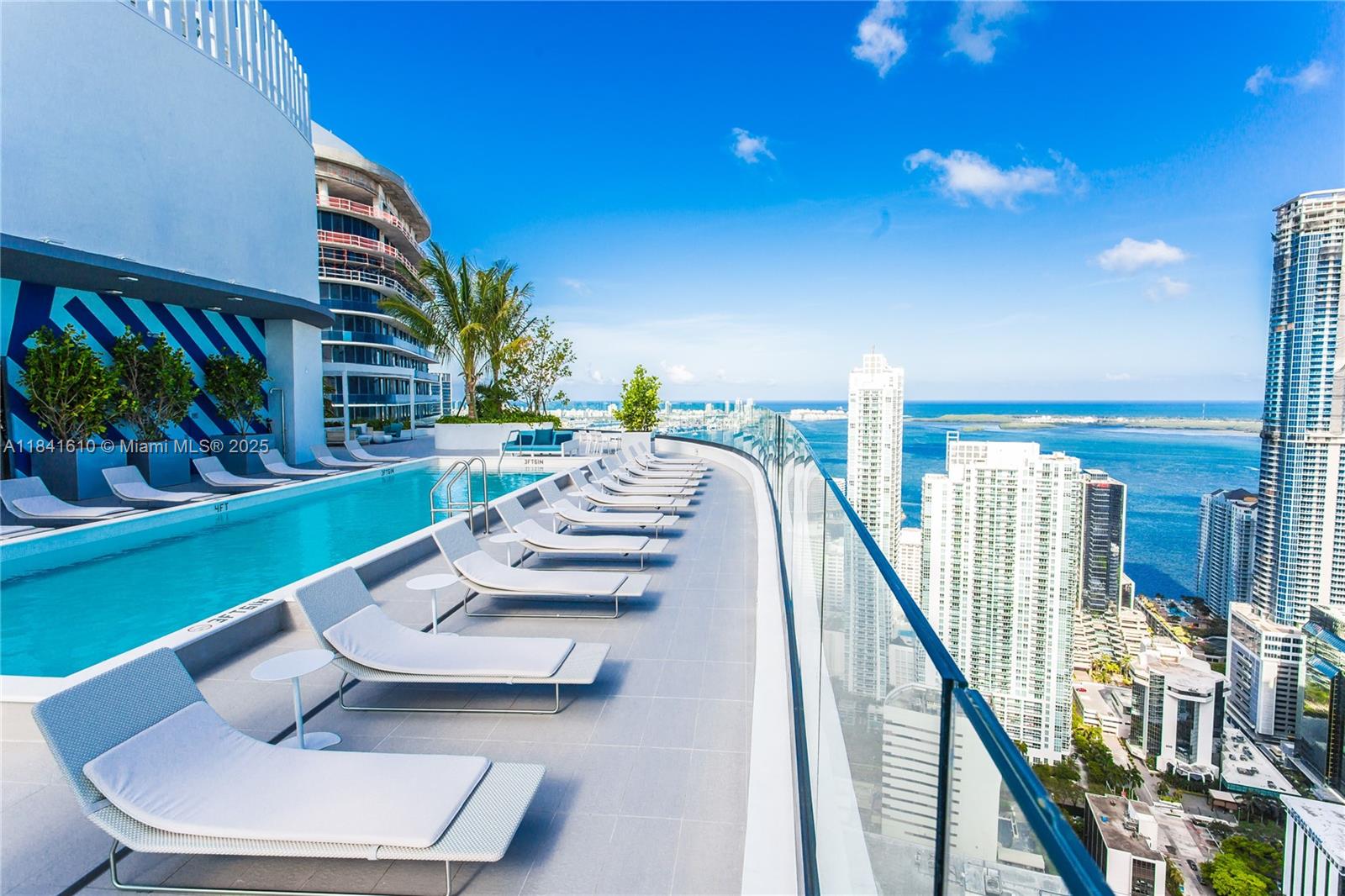 45 Southwest 9th Street, Unit 3803 Miami, FL 33130 - Photo 17 of 54 a view of an chairs and tables in patio