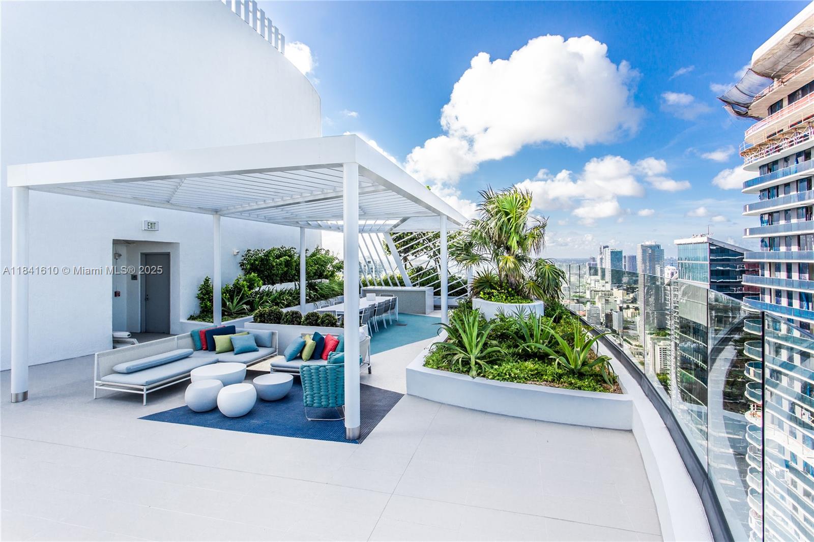 45 Southwest 9th Street, Unit 3803 Miami, FL 33130 - Photo 19 of 54 a living room filled with furniture and a chandelier