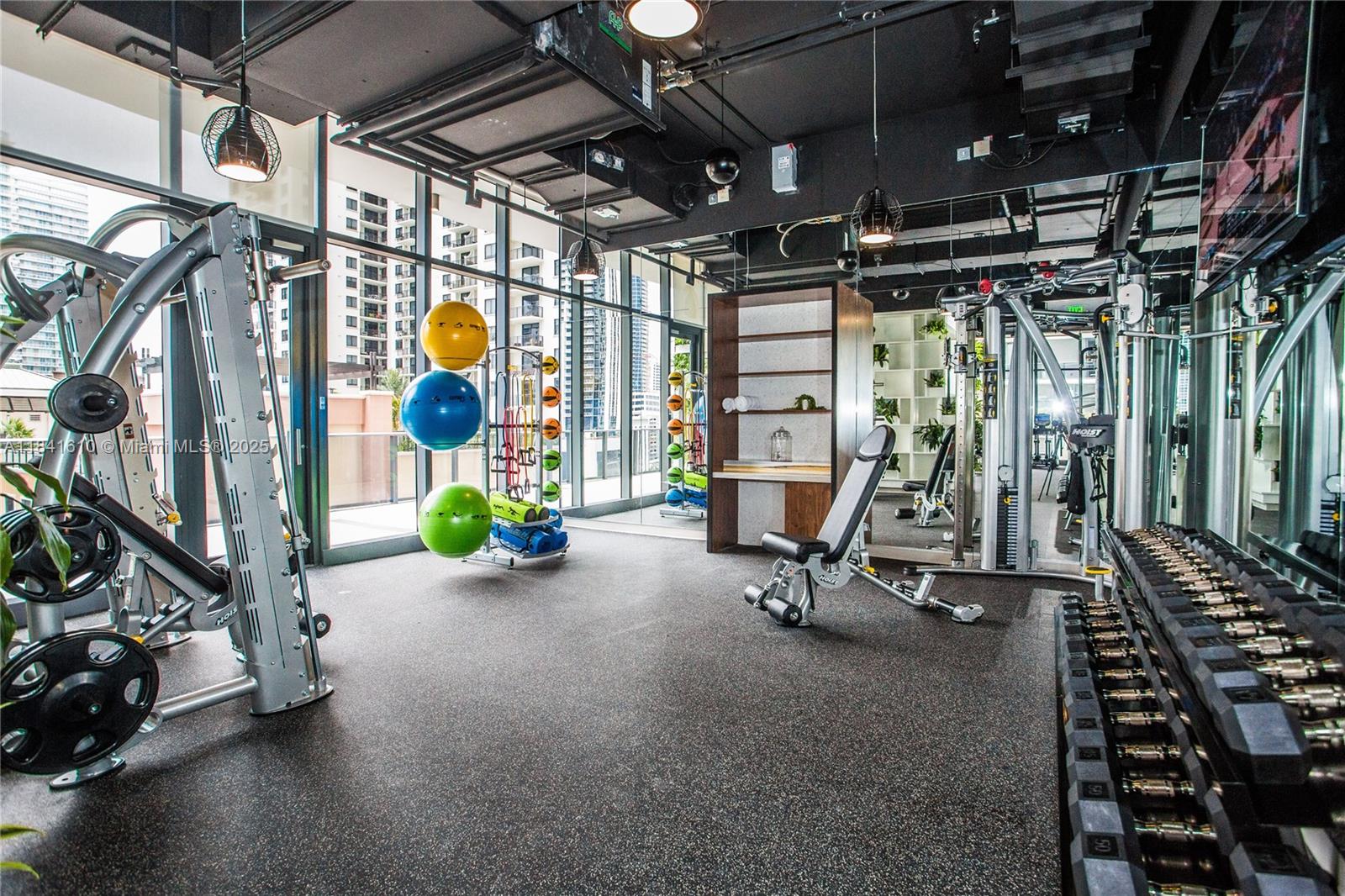 45 Southwest 9th Street, Unit 3803 Miami, FL 33130 - Photo 26 of 54 a view of a room with gym equipment