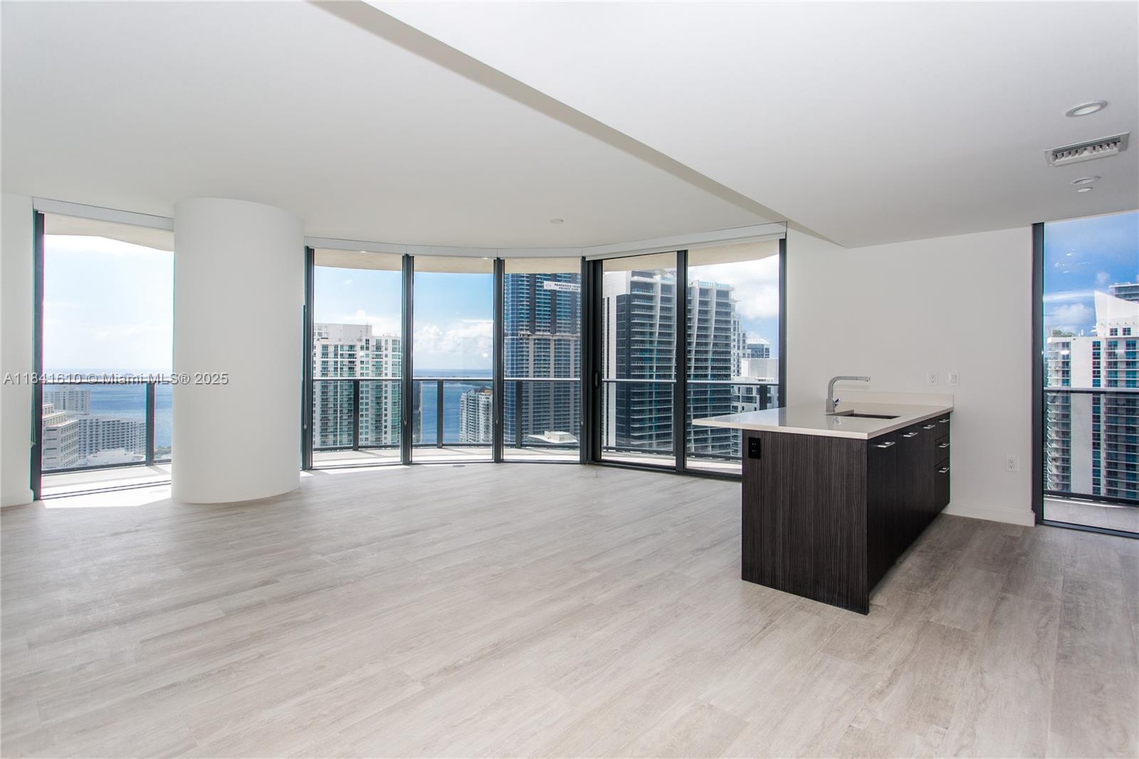 45 Southwest 9th Street, Unit 3803 Miami, FL 33130 - Photo 4 of 54 a living room with furniture and large windows