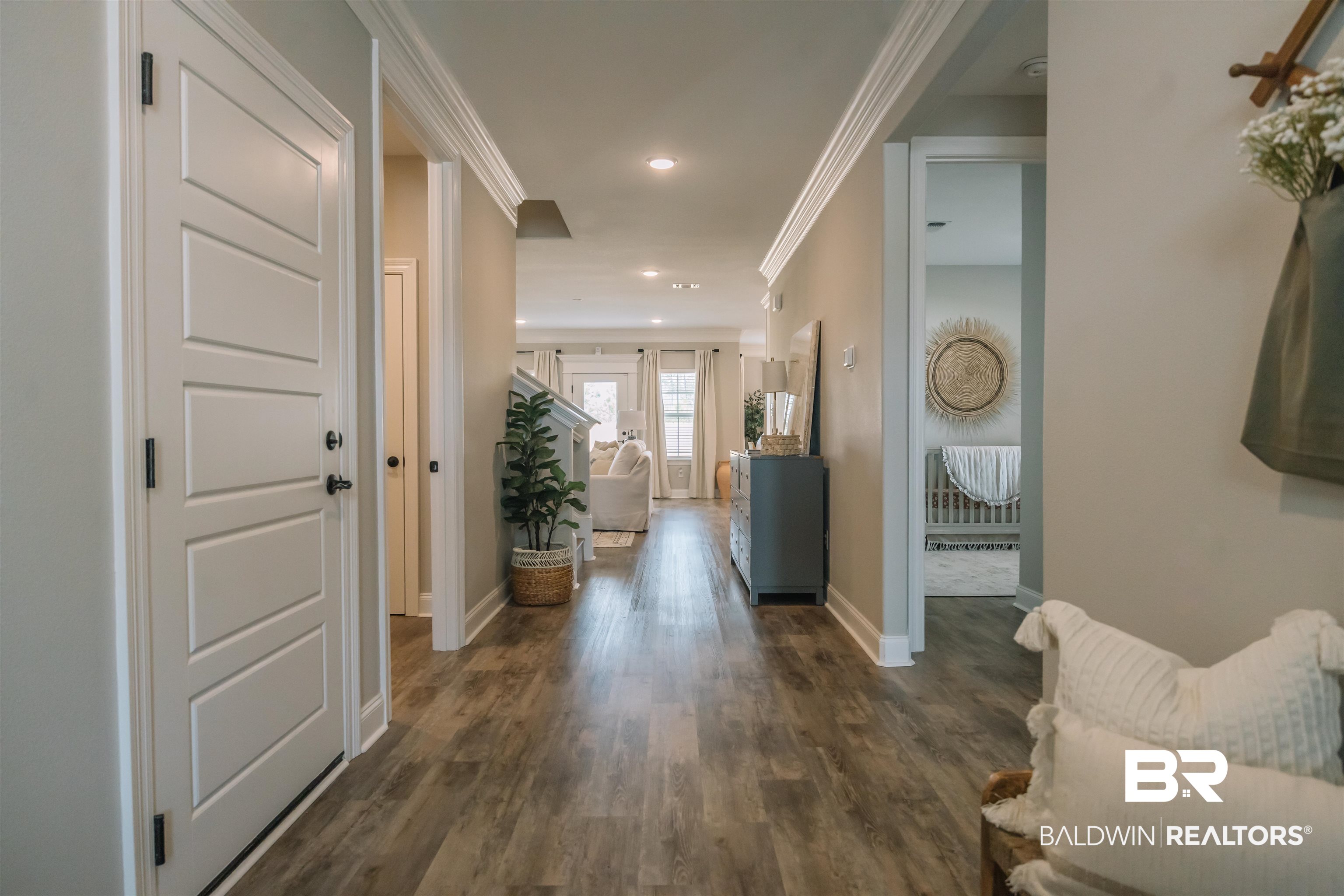 12894 Flanagan Street Elberta, AL 36530 - Photo 3 of 29 Corridor featuring ornamental molding and dark hardwood / wood-style floors