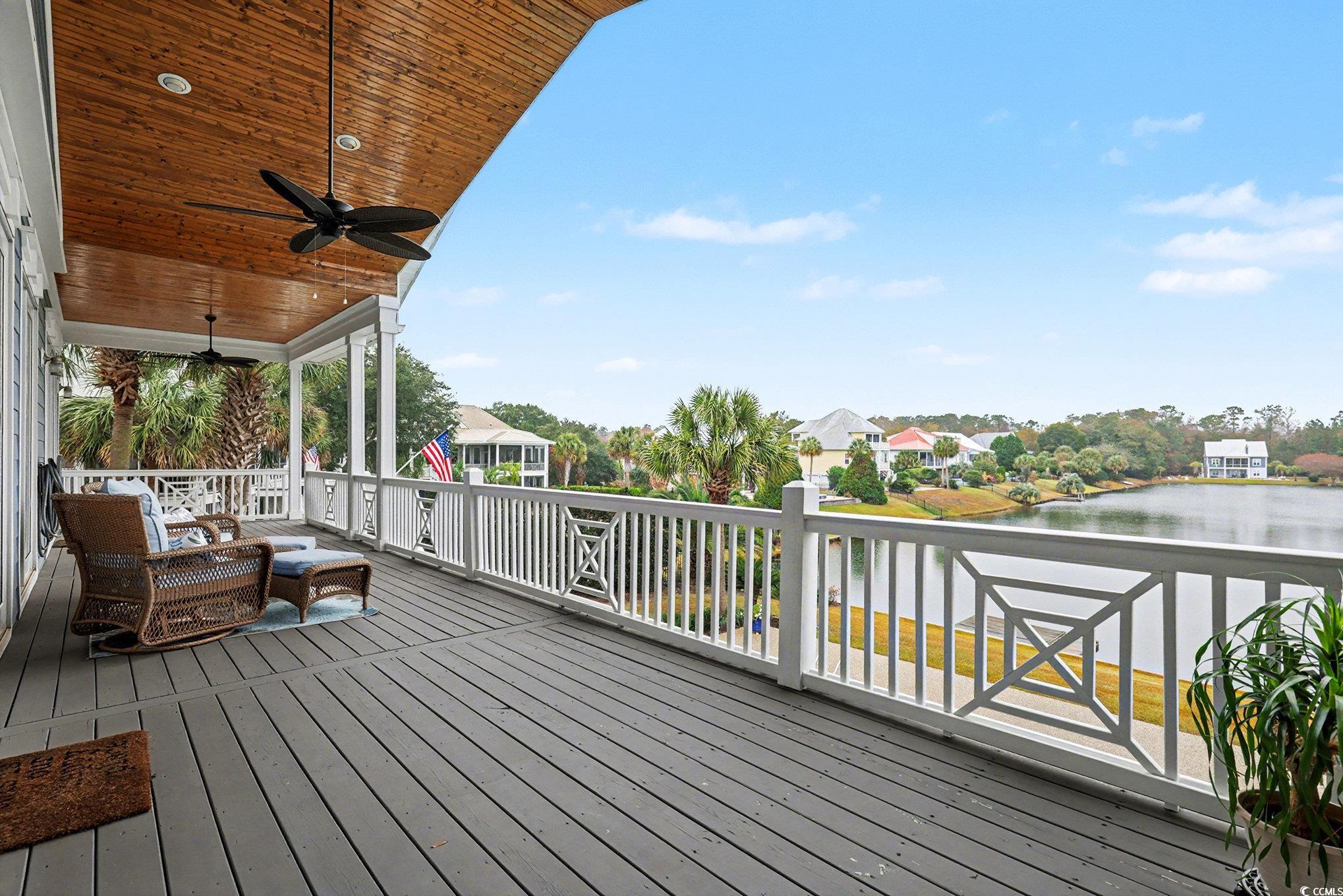 1710 Pond Road Murrells Inlet, SC 29576 - Photo 13 of 39 Wooden deck with a water view and a ceiling fan
