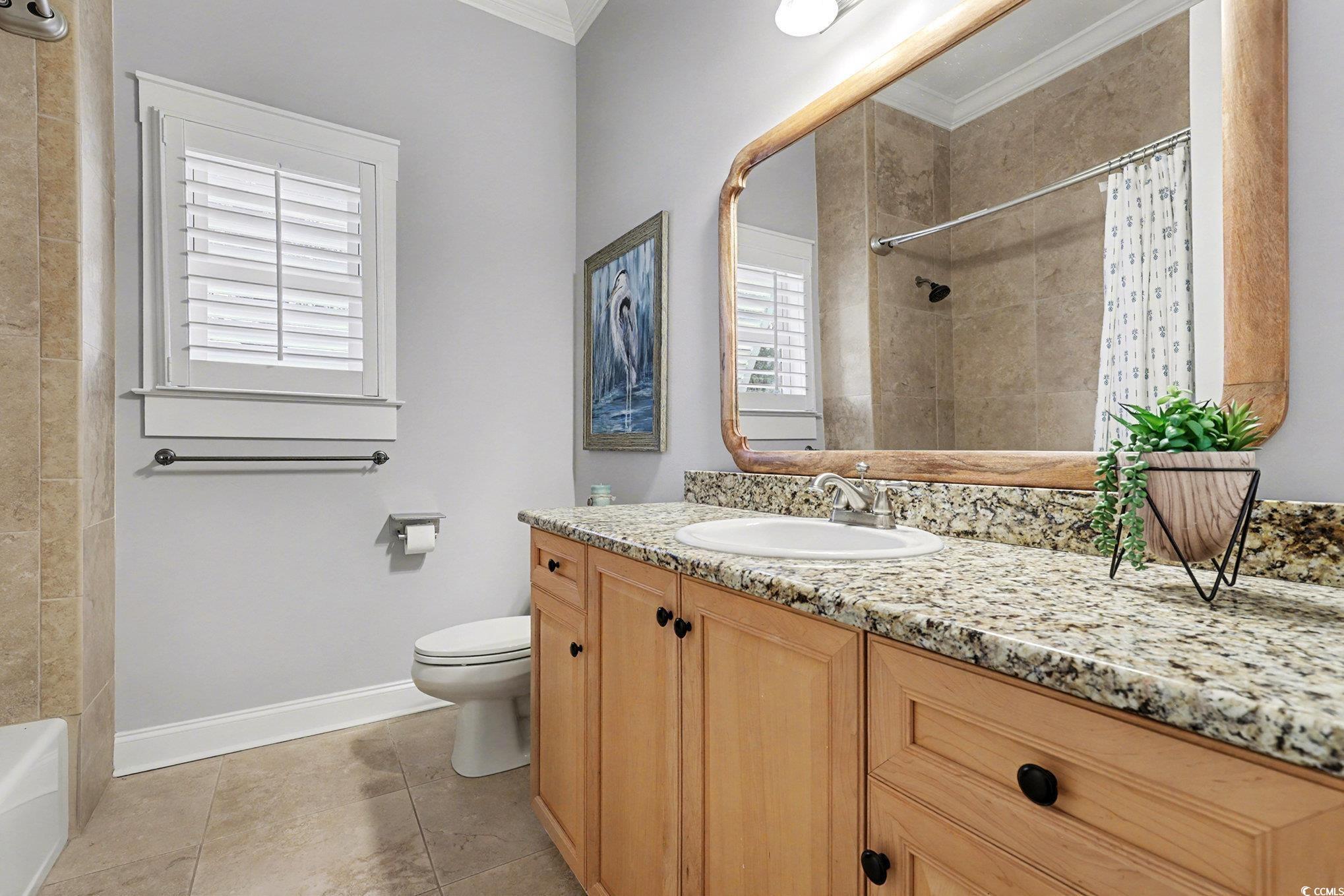 1710 Pond Road Murrells Inlet, SC 29576 - Photo 23 of 39 Bathroom with vanity, ornamental molding, and light tile patterned floors
