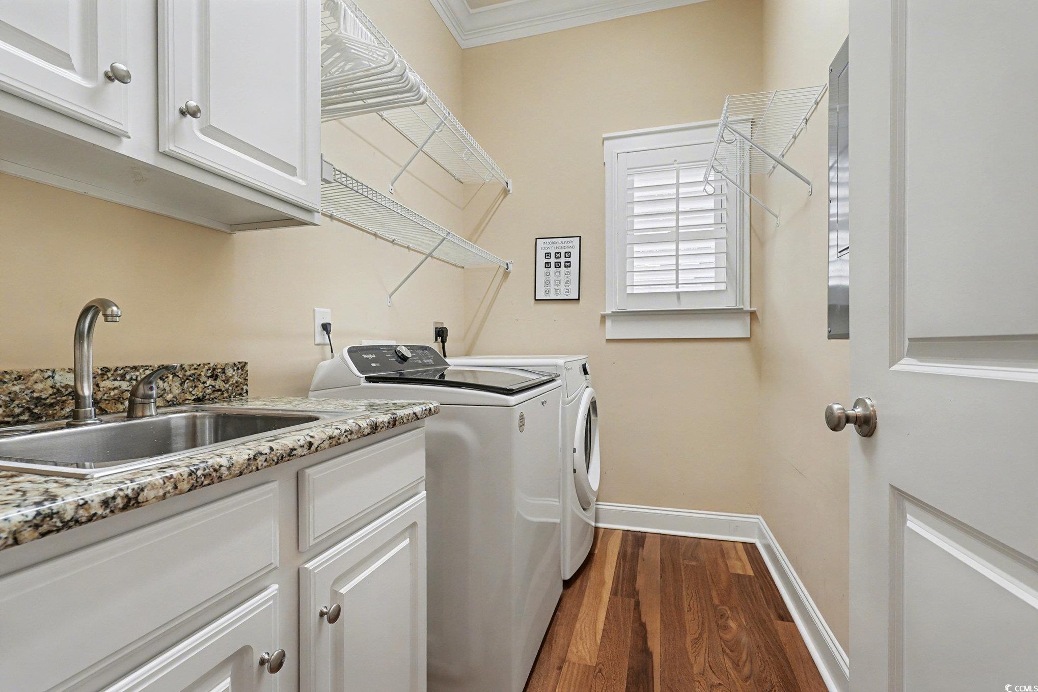 1710 Pond Road Murrells Inlet, SC 29576 - Photo 24 of 39 Laundry area featuring dark wood-style floors, cabinet space, independent washer and dryer, and ornamental molding