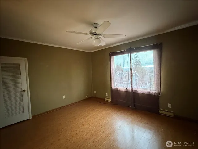 a view of an empty room with a window