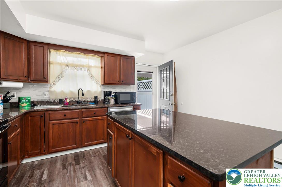 326 Chestnut Street Slatington, PA 18080 - Photo 9 of 28 a kitchen with stainless steel appliances granite countertop a sink stove and cabinets