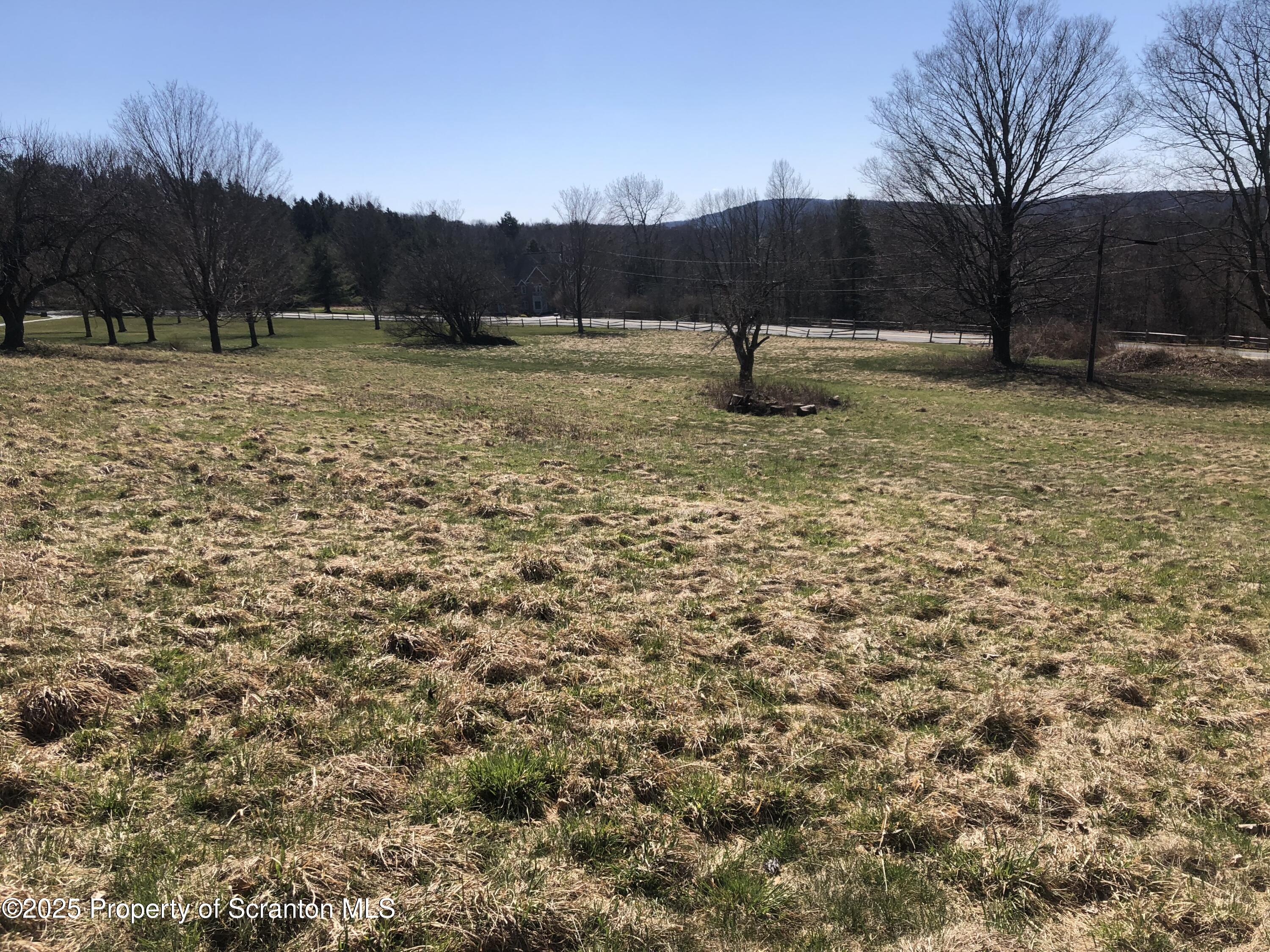 632 Lily Lake Road Dalton, PA 18414 - Photo 3 of 4 a view of a yard with wooden fence
