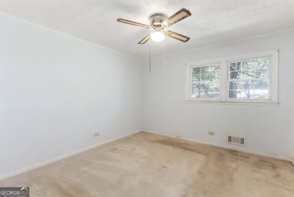a bathroom with a sink toilet and a mirror
