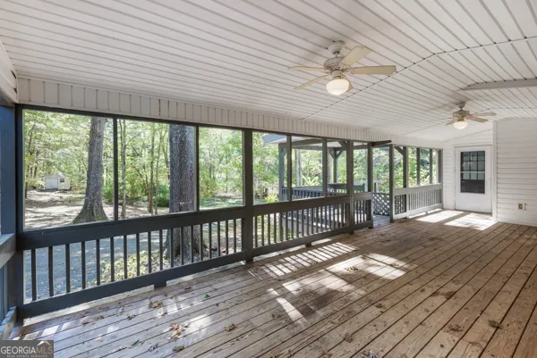 a view of balcony with wooden floor