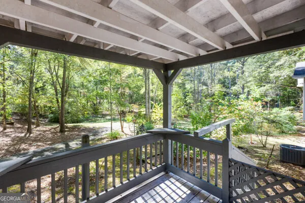 a view of a porch with wooden floor