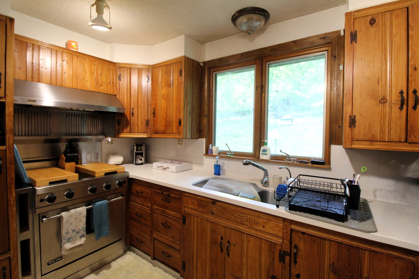 1843 North River Road Algonquin, IL 60102 - Photo 6 of 13 a kitchen with a sink stove and cabinets