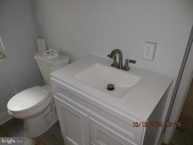 203 South Exeter Street Baltimore, MD 21202 - Photo 4 of 5 a white toilet sitting next to a sink