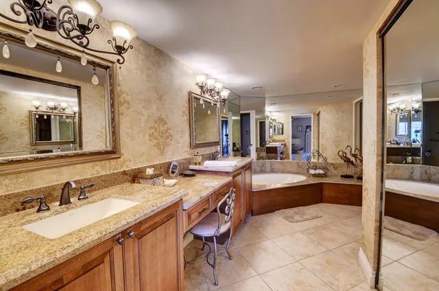 a bathroom with a toilet a sink and shower