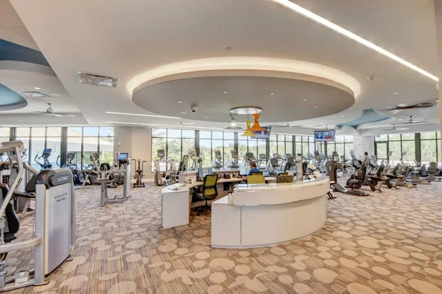 a view of swimming pool with outdoor seating and plants
