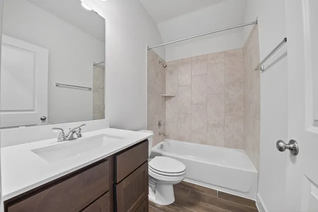 a bathroom with a sink a toilet and a bathtub