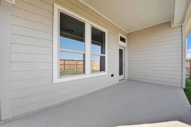 a view of a yard in front of a house with plants