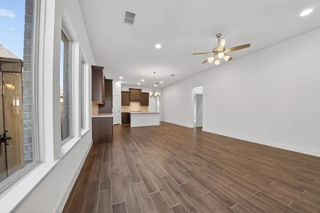 a view of a kitchen with a dishwasher and a stove top oven