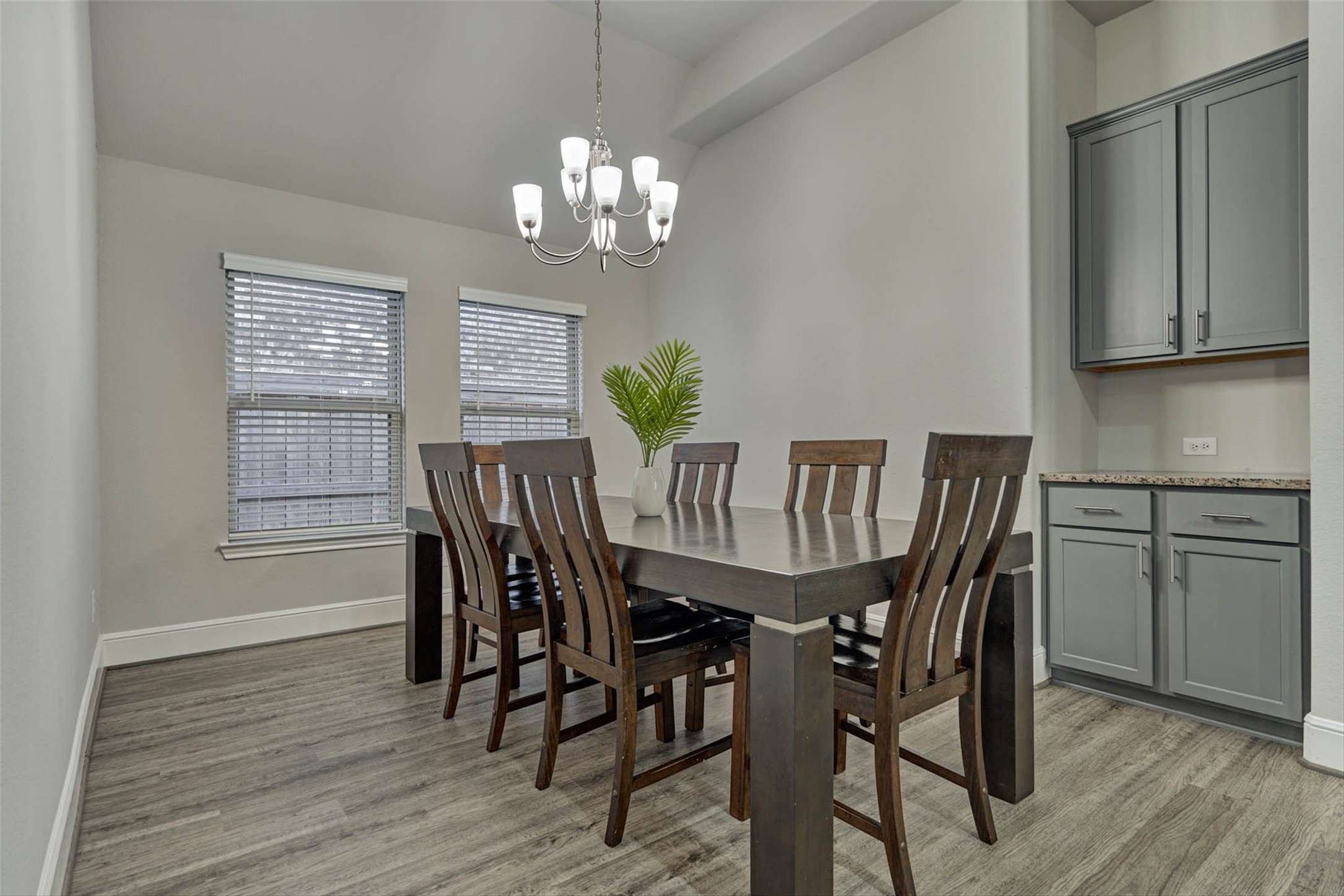 10660 Red Tail Place Conroe, TX 77385 - Photo 13 of 50 a view of a dining room with furniture a chandelier and wooden floor