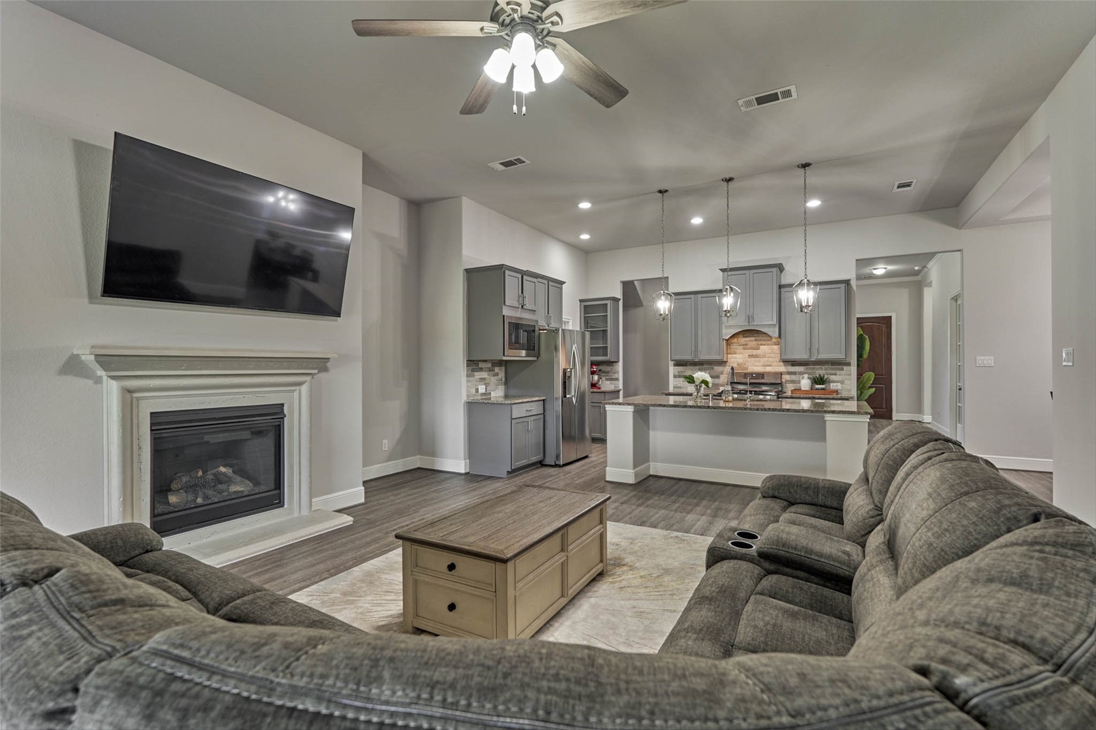 10660 Red Tail Place Conroe, TX 77385 - Photo 14 of 50 a living room with furniture and a fireplace