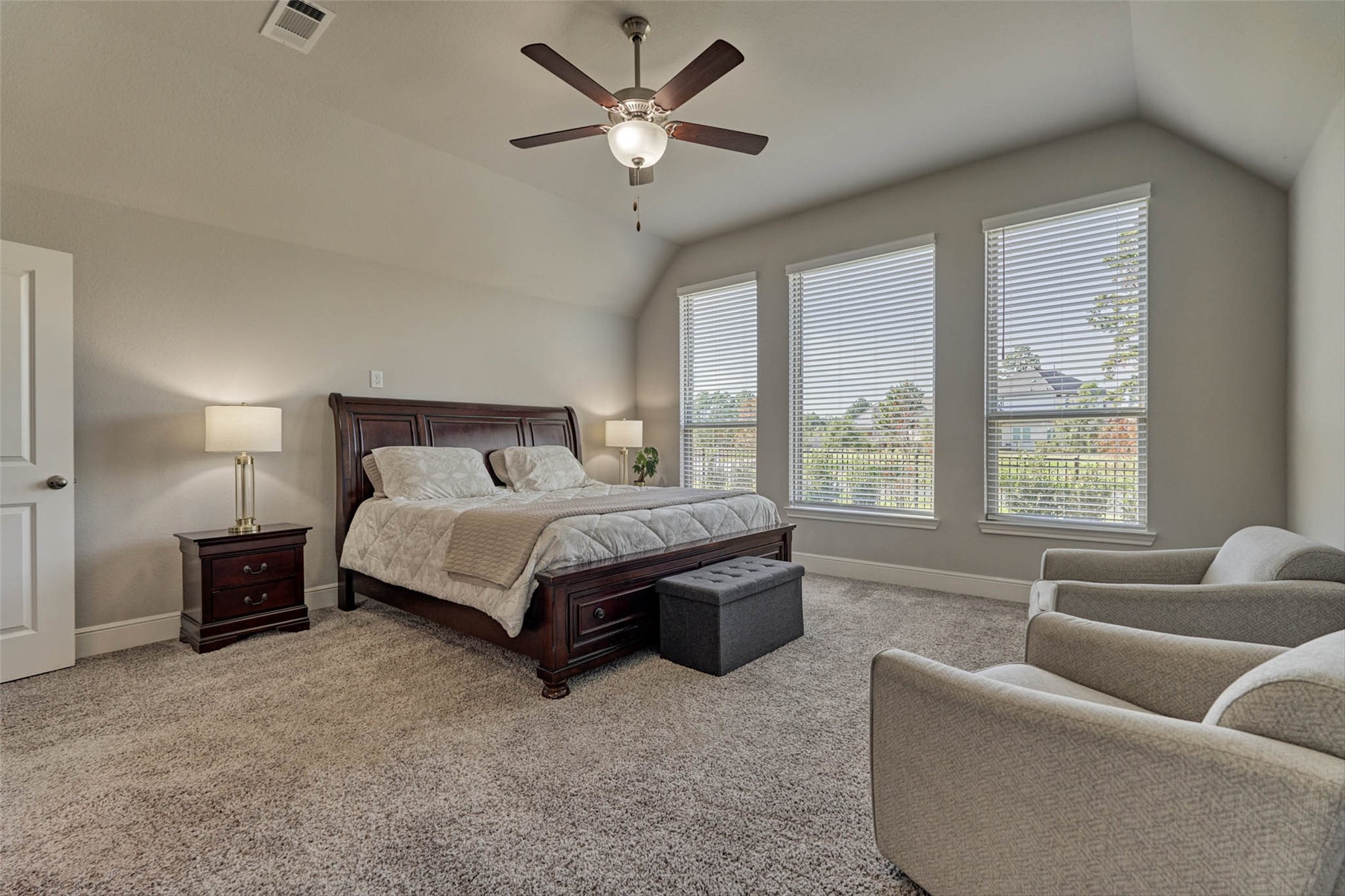 10660 Red Tail Place Conroe, TX 77385 - Photo 19 of 50 a bedroom with a bed couch and window