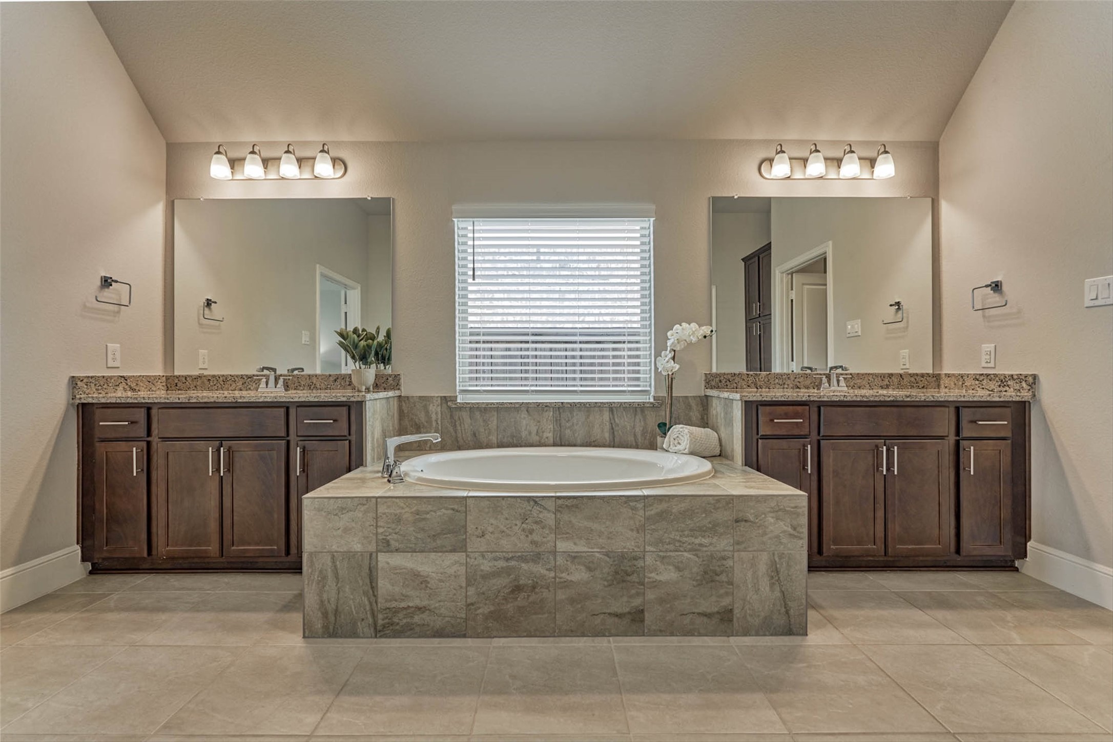 10660 Red Tail Place Conroe, TX 77385 - Photo 22 of 50 a spacious bathroom with a sink a large mirror and a bathtub