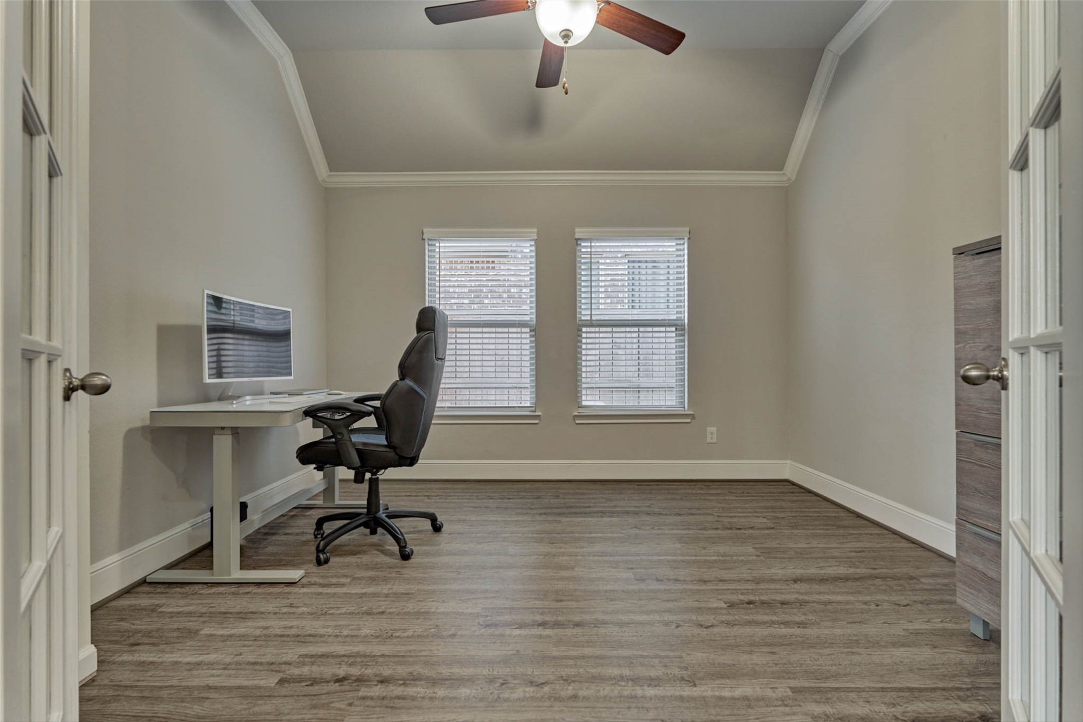 10660 Red Tail Place Conroe, TX 77385 - Photo 25 of 50 a view of a workspace with wooden floor and a window