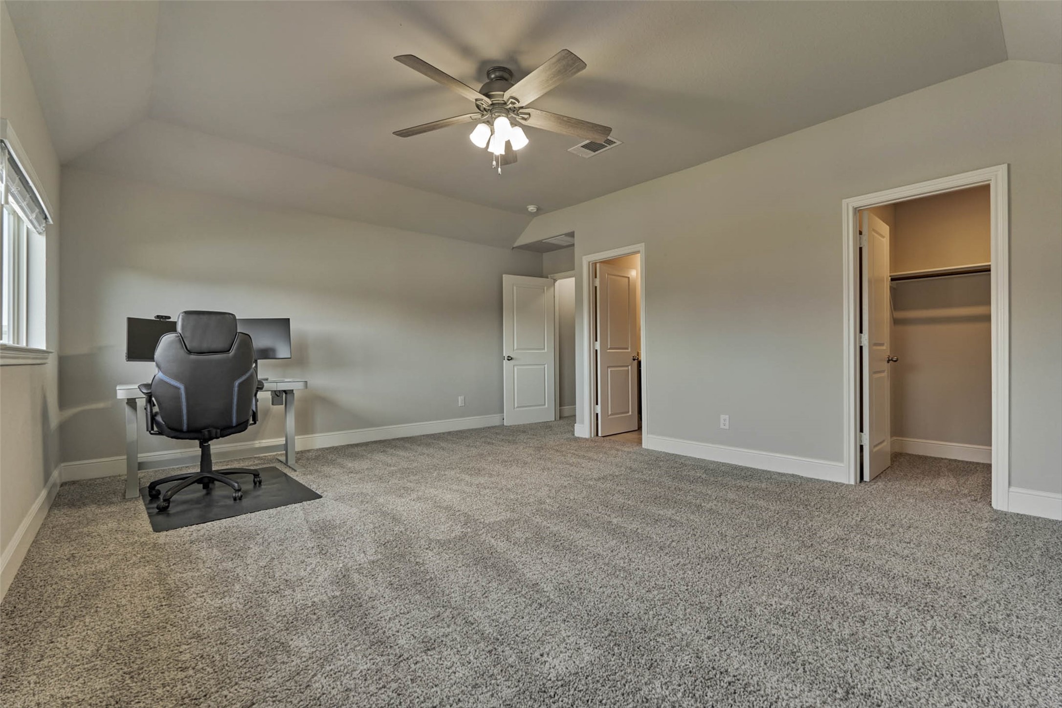 10660 Red Tail Place Conroe, TX 77385 - Photo 37 of 50 a view of workspace with a ceiling fan chair and a chandelier fan