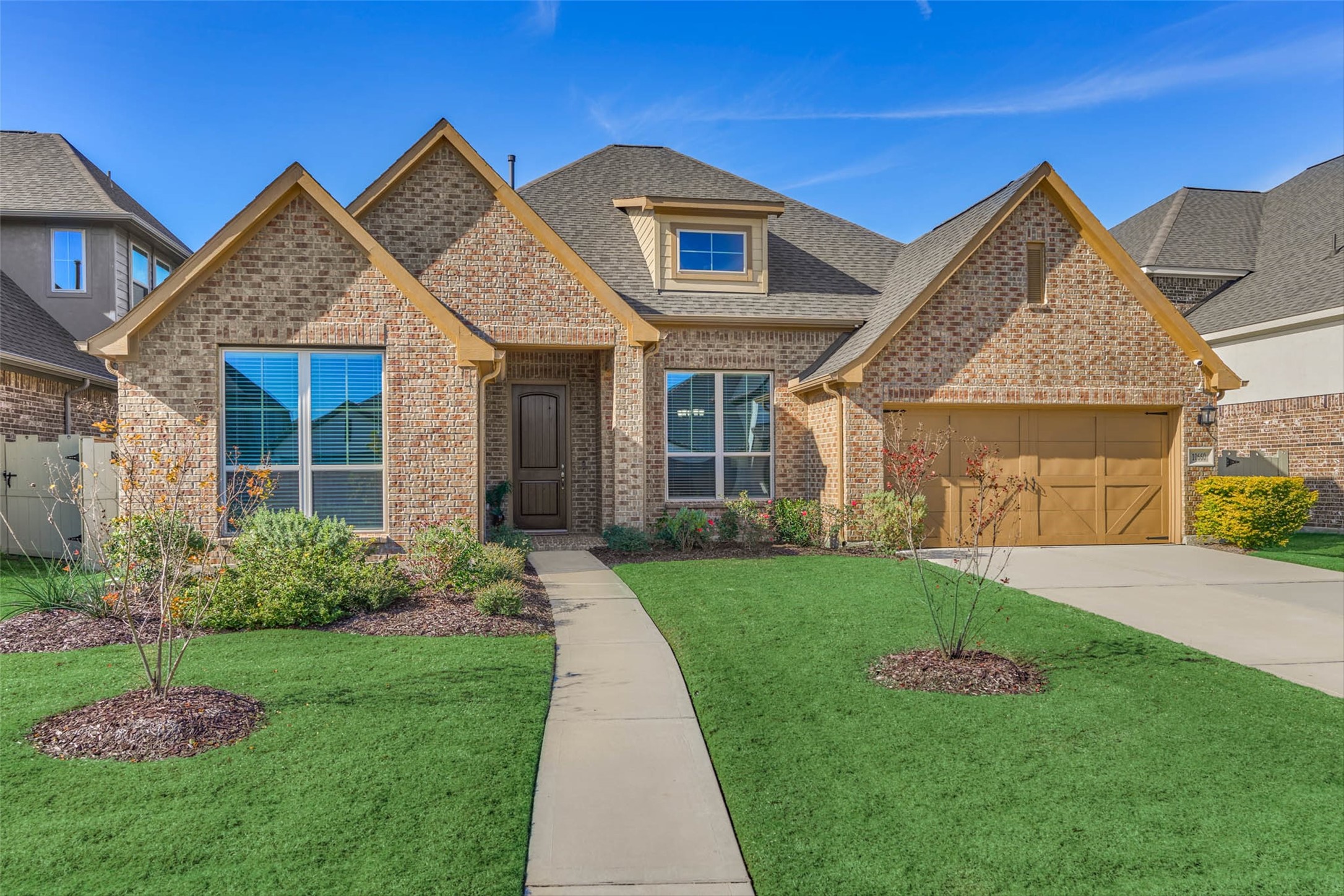 10660 Red Tail Place Conroe, TX 77385 - Photo 50 of 50 a front view of a house with a garden