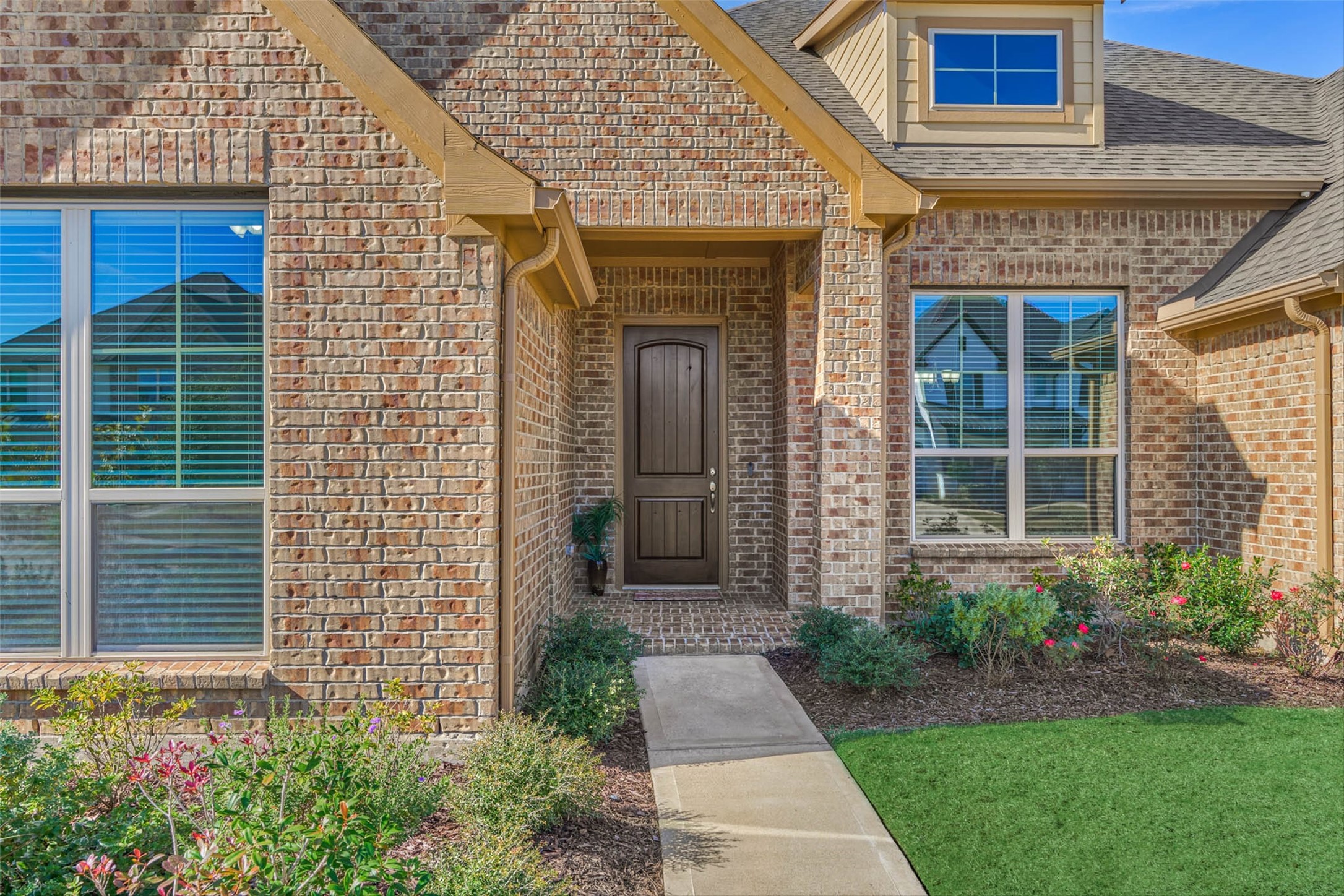 10660 Red Tail Place Conroe, TX 77385 - Photo 5 of 50 a front view of a house with garden