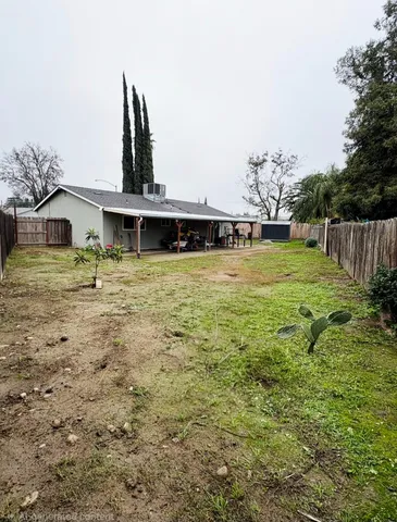 a house with yard in front of it