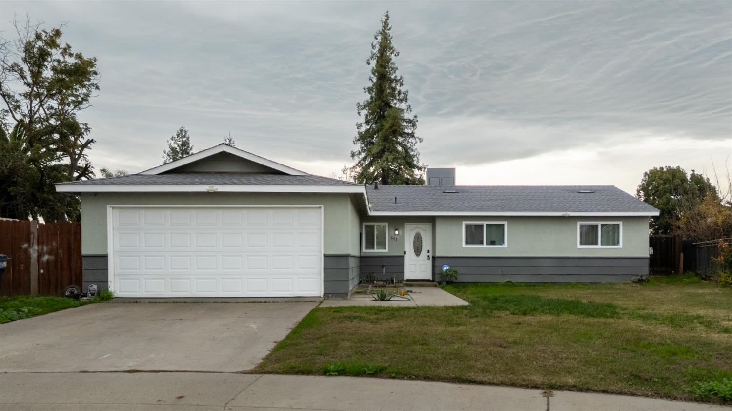 601 Summit Court Modesto, CA 95357 - Photo 17 of 17 a front view of a house with a yard