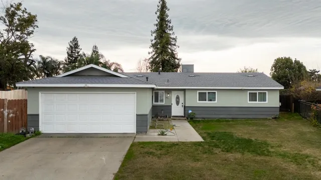 a front view of a house with yard
