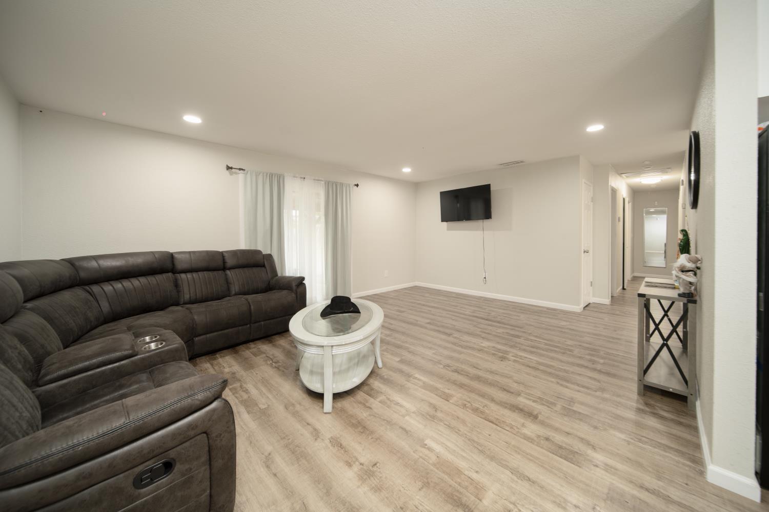 601 Summit Court Modesto, CA 95357 - Photo 8 of 17 a living room with furniture and a wooden floor