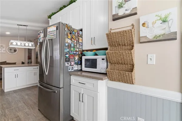 a kitchen with stainless steel appliances a refrigerator and a stove