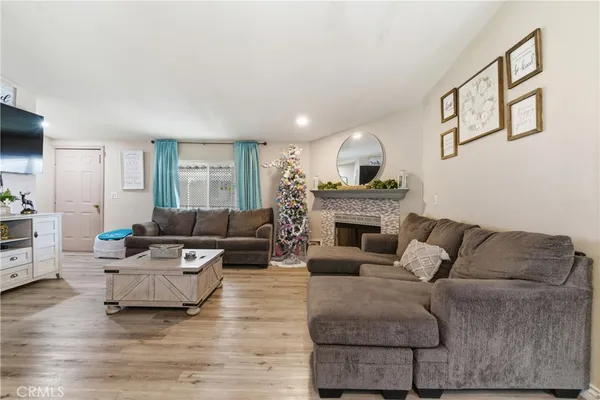 a living room with furniture and a fireplace