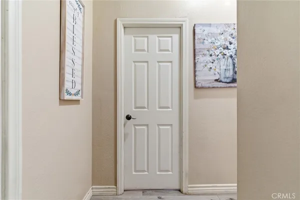 an entryway with wooden floor
