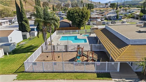a view of multiple houses with yard