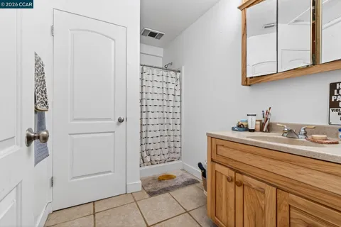 a bed room with a bed and a large window