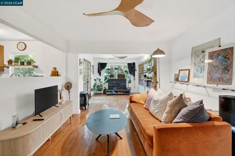 a living room with furniture flat screen tv and a fireplace