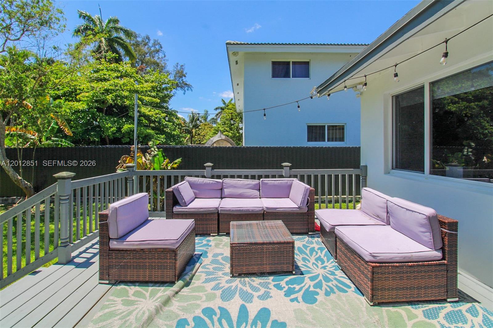 360 Northeast 116th Street Miami, FL 33161 - Photo 20 of 29 a patio with patio a couch and chairs