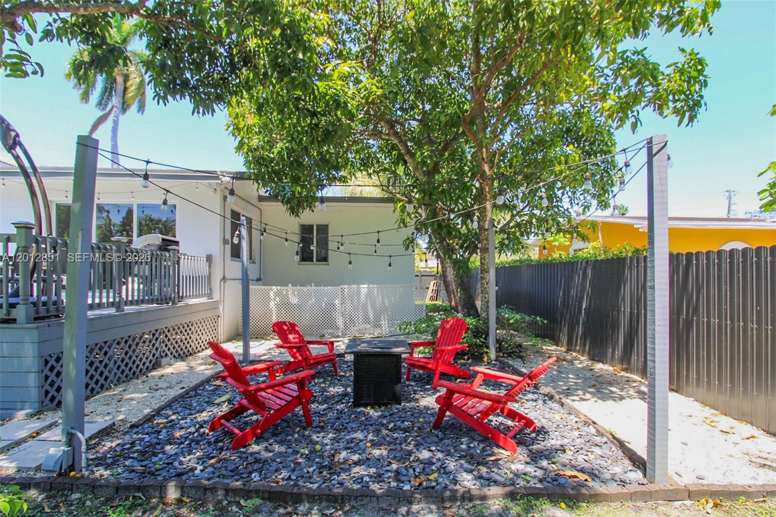 360 Northeast 116th Street Miami, FL 33161 - Photo 22 of 29 a wooden bench sitting in front of a building